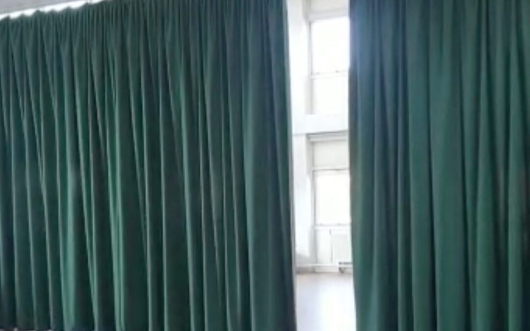 Motorised curtain and track system for hall